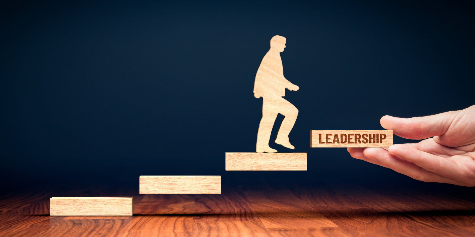 cut out figure of a professional climbing the career ladder to become a leader