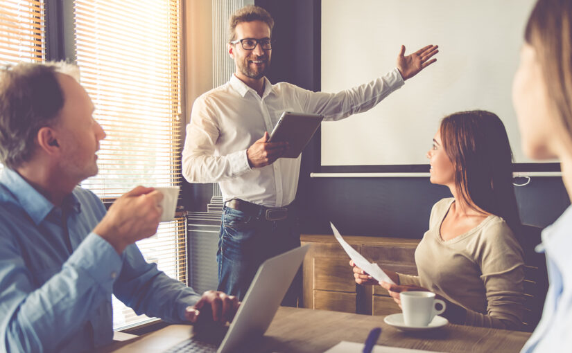 People in a meeting - someone presenting